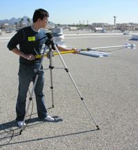 Dr. Jo measuring sunlight reflectivity of a Phoenix-area rooftop